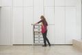 Woman Looking In Wardrobe In Empty Apartment Royalty Free Stock Photo