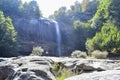 A woman looking at the waterfall