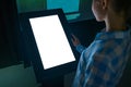Woman using interactive white empty touchscreen display kiosk at exhibition Royalty Free Stock Photo