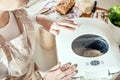 Woman looks at how the bread maker works