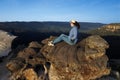 Woman looks at the landscape from Lincoln Rock Lookout at sunrise of the Grose Valley located within the Blue Mountains New South Royalty Free Stock Photo