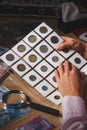 Woman looks at the page with coins in the pockets