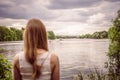 The woman looks at the wakeboarder on the river Royalty Free Stock Photo