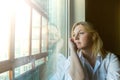 The woman lost in thought looking out the window. Royalty Free Stock Photo