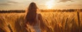 A Woman Lost In A Thought Wandering Through A Field Of Tall, Golden Wheat At Sunset, Authenticity