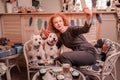 Woman loving her pets making photo with her birthday dogs