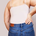 Woman lower back pain. Hold hand near body Royalty Free Stock Photo