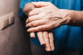 Woman lubricates tired and dry hands from frequent washing