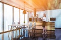 Woman in luxury marble floor kitchen with table Royalty Free Stock Photo