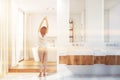 Woman in luxury white bathroom interior Royalty Free Stock Photo