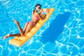 Woman lying on air mattress in the swimming pool Royalty Free Stock Photo