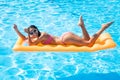 Woman lying on air mattress in the swimming pool Royalty Free Stock Photo