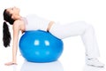 Woman lying on back on the pilates ball Royalty Free Stock Photo