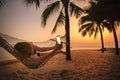 woman lying in beach cradle and taking a photograph by smart phone Royalty Free Stock Photo