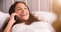 Woman Lying In Bed Having Conversation On Mobile Phone Royalty Free Stock Photo