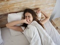 woman lying in bed wake up morning yawn Royalty Free Stock Photo