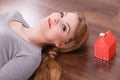 Woman lying with cash box. Royalty Free Stock Photo