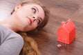 Woman lying with cash box. Royalty Free Stock Photo