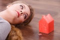 Woman lying with cash box. Royalty Free Stock Photo