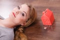 Woman lying with cash box. Royalty Free Stock Photo