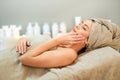 Woman lying on couch in spa center Royalty Free Stock Photo