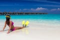 Woman lying down with snorkeling flippers and mask on a tropical beach Royalty Free Stock Photo