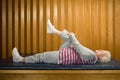 Woman lying down stretching Royalty Free Stock Photo