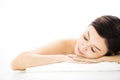 Woman lying down on towel during skin care Royalty Free Stock Photo