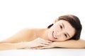 Woman lying down on towel during skin care Royalty Free Stock Photo