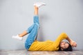 Woman lying on the floor with raised legs up Royalty Free Stock Photo