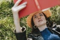 Woman lying on the grass and reading a book Royalty Free Stock Photo