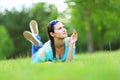 Woman lying on the grass at summer sunset. Royalty Free Stock Photo