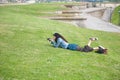 Woman lying on the grass taking a picture Royalty Free Stock Photo