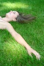 Woman lying on a lawn