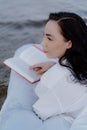 A woman lying on a mattress in the water. Royalty Free Stock Photo