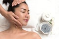 Woman lying and preparation face or head massage in spa Royalty Free Stock Photo