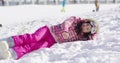 Woman lying on snow