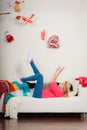 Woman lying on sofa, pelted clothes