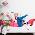 Woman lying on sofa, pelted clothes Royalty Free Stock Photo