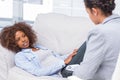 Woman lying on sofa and speaking to her therapist Royalty Free Stock Photo