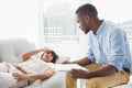 Woman lying on sofa talking to her therapist Royalty Free Stock Photo