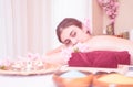 Woman lying on Spa massage bed with spa equipment on foreground Royalty Free Stock Photo