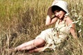 Woman lying on summer field among flowers Royalty Free Stock Photo