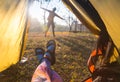 Woman lying in a tent with coffee ,view of mountains and sky Royalty Free Stock Photo