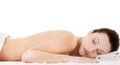 Woman lying on a towel ready to massage Royalty Free Stock Photo