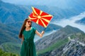 Woman with macedonian flag on the top of mountain Royalty Free Stock Photo