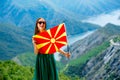 Woman with macedonian flag on the top of mountain Royalty Free Stock Photo