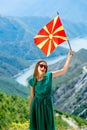 Woman with macedonian flag on the top of mountain Royalty Free Stock Photo