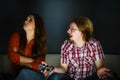 Woman is bored while man playing games