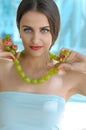 Woman made a beads from green grapes